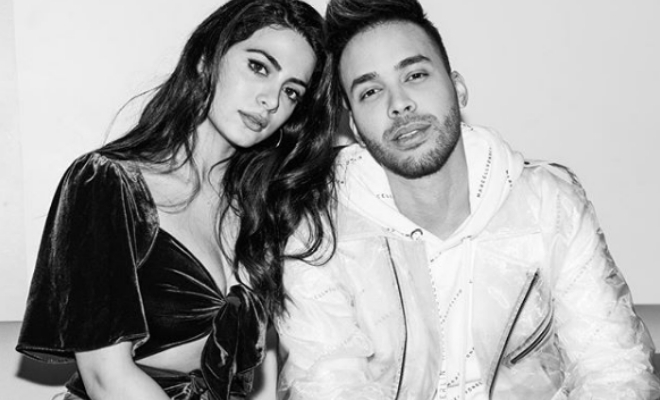 Black and white photo of Prince Royce and Emeraude Toubia