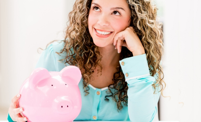curly haired gift with pink piggy bank