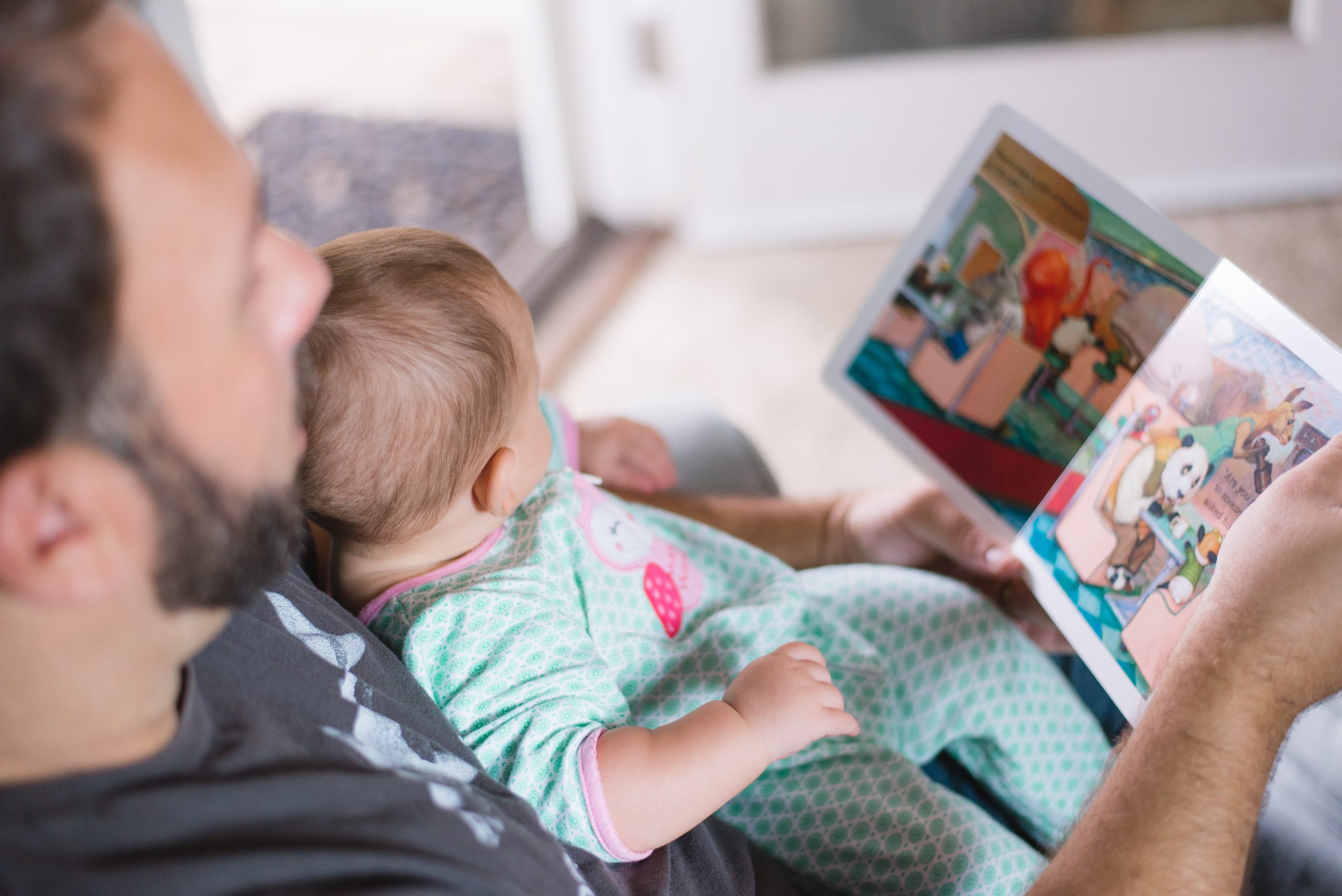 Father reading to baby - Kids books with Latino authors